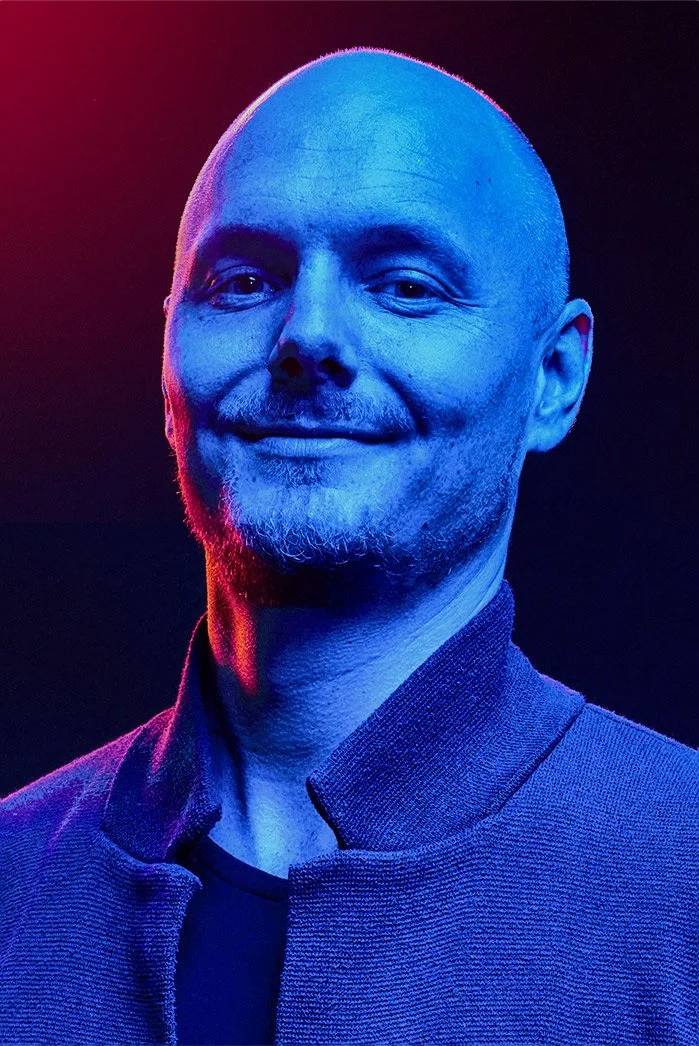 Václav Krbůšek, director, lit in blue and purple